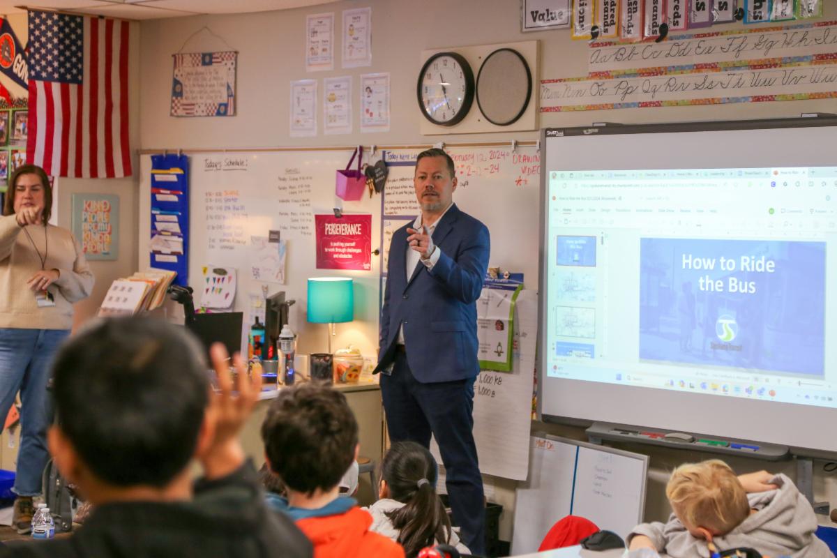 A photo of STA Business Development Manager Dainon Setzer calling on a student who is raising their hand