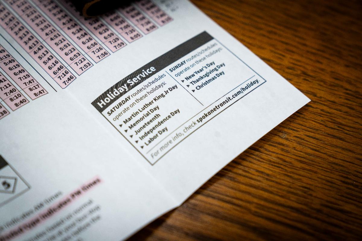 A photo of a table containing the new STA Holiday service hours in a printed bus schedule pamphlet