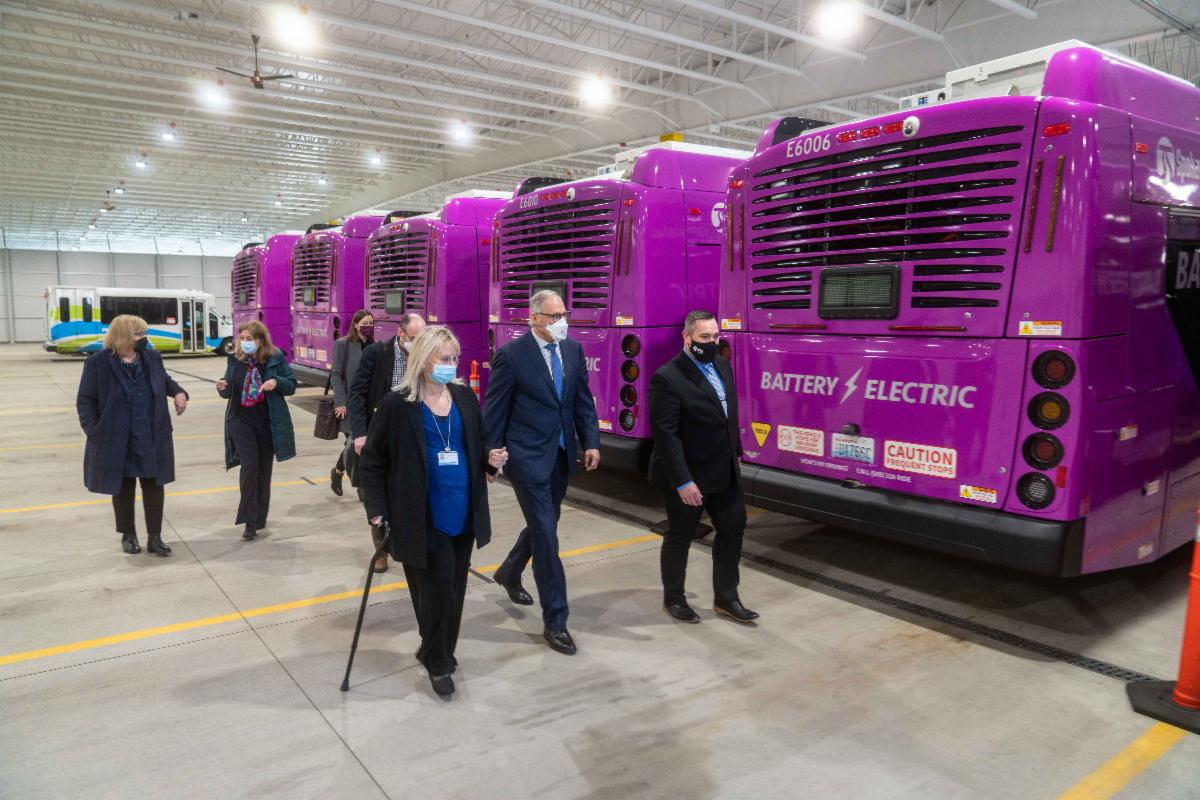 A photo of Susan and others inspecting the new City Line fleet