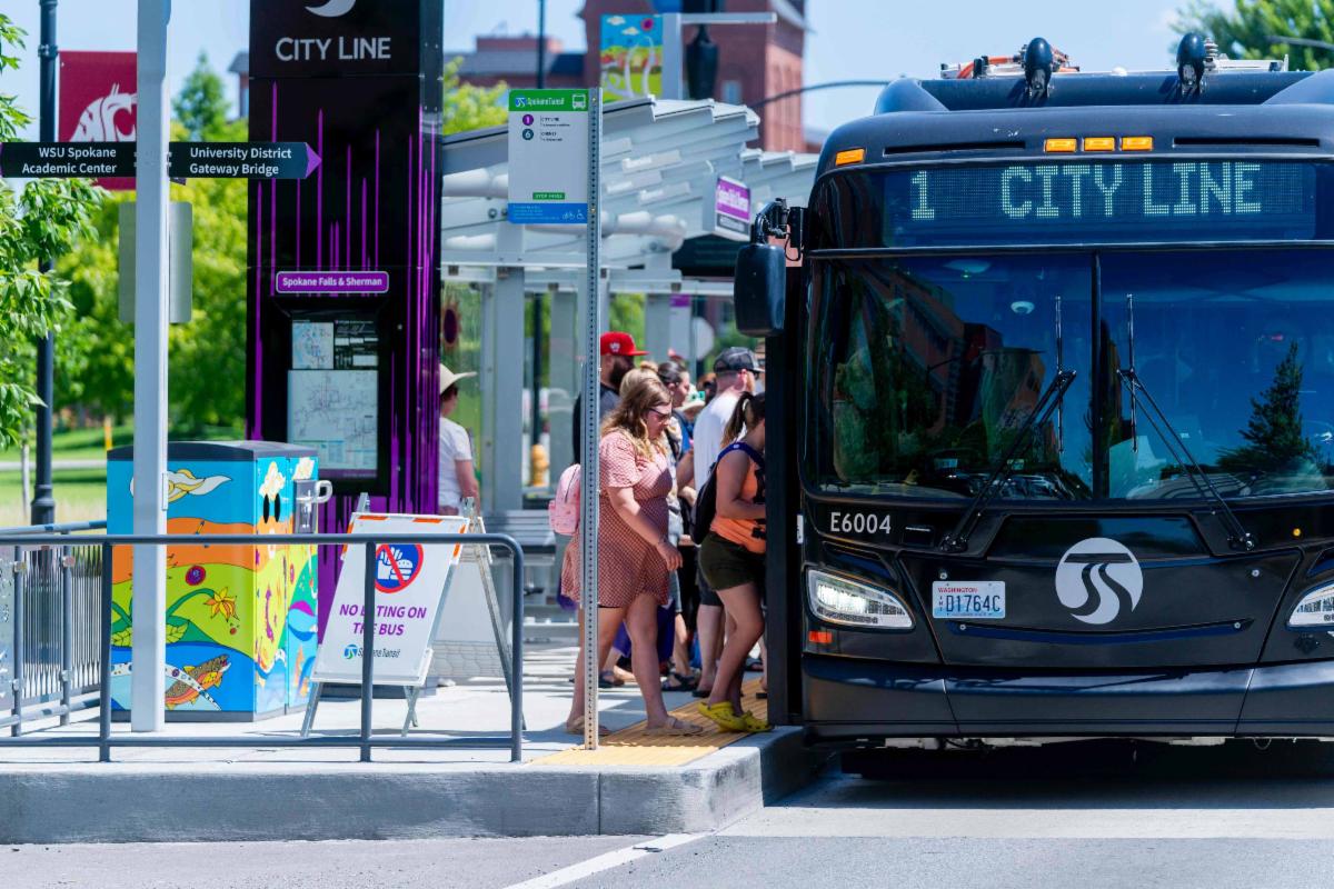 Riders boarding a City Line bus