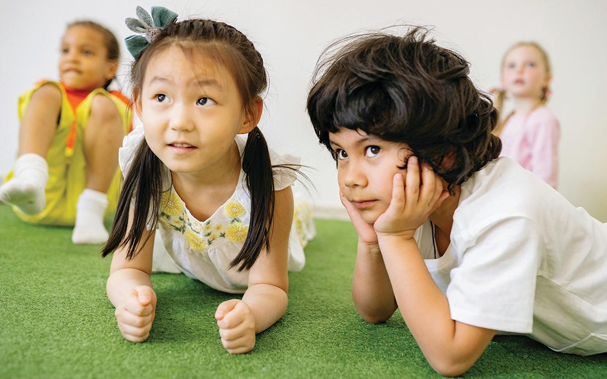 Diverse group of kids playing on the floor