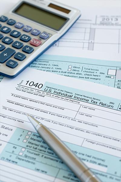 tax forms and a calculator