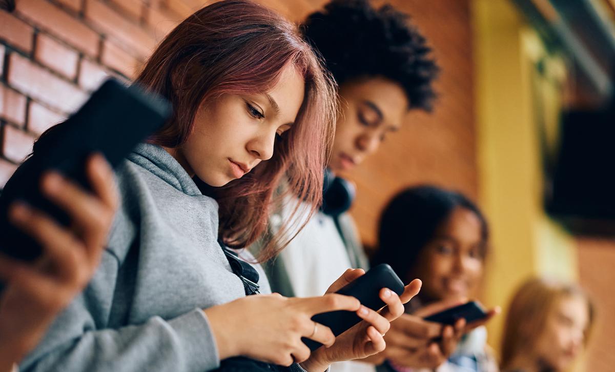 teens on phones together