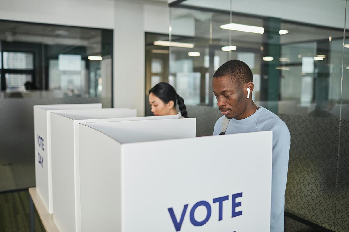 People at voting stations.