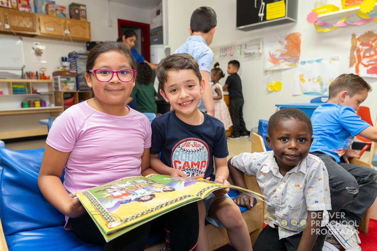 Children in a preschool reading together.