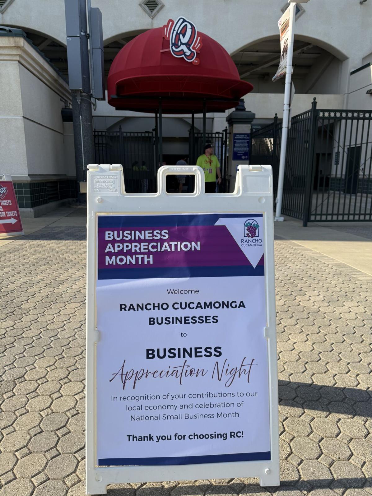 A City of Rancho Cucamonga sign outside a stadium entrance welcomes local businesses to Business Appreciation Night in celebration of National Small Business Month and thanks them for choosing Rancho Cucamonga.