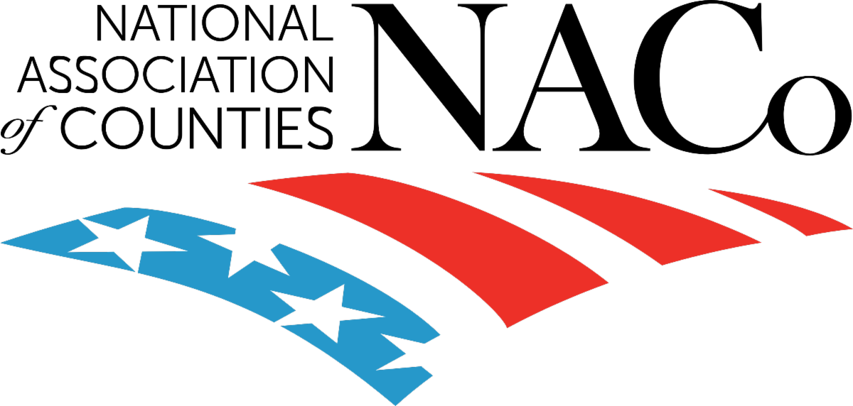 National Association of Counties patriotic ribbon graphic with blue stars and red stripes.
