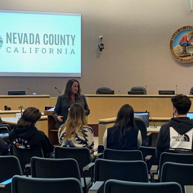 County Executive Officer Alison Lehman talks to high school students.