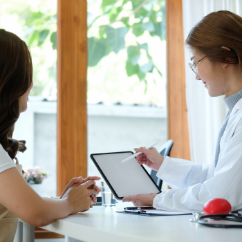 Patient talking with a doctor. 