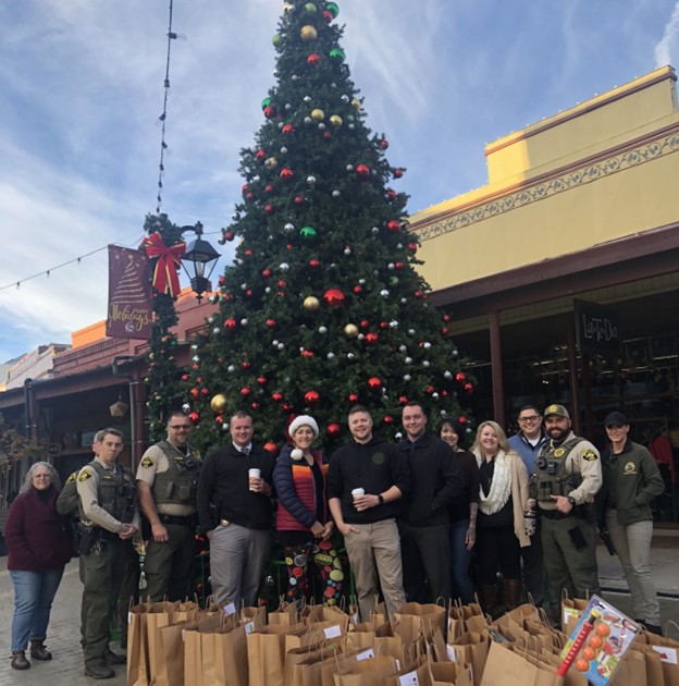 People in front of Christmas tree