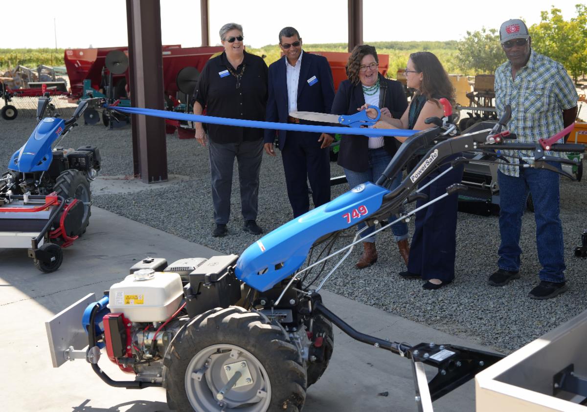Organizers and dignitaries cut the ribbon to open the equipment lending library at Kearney REC