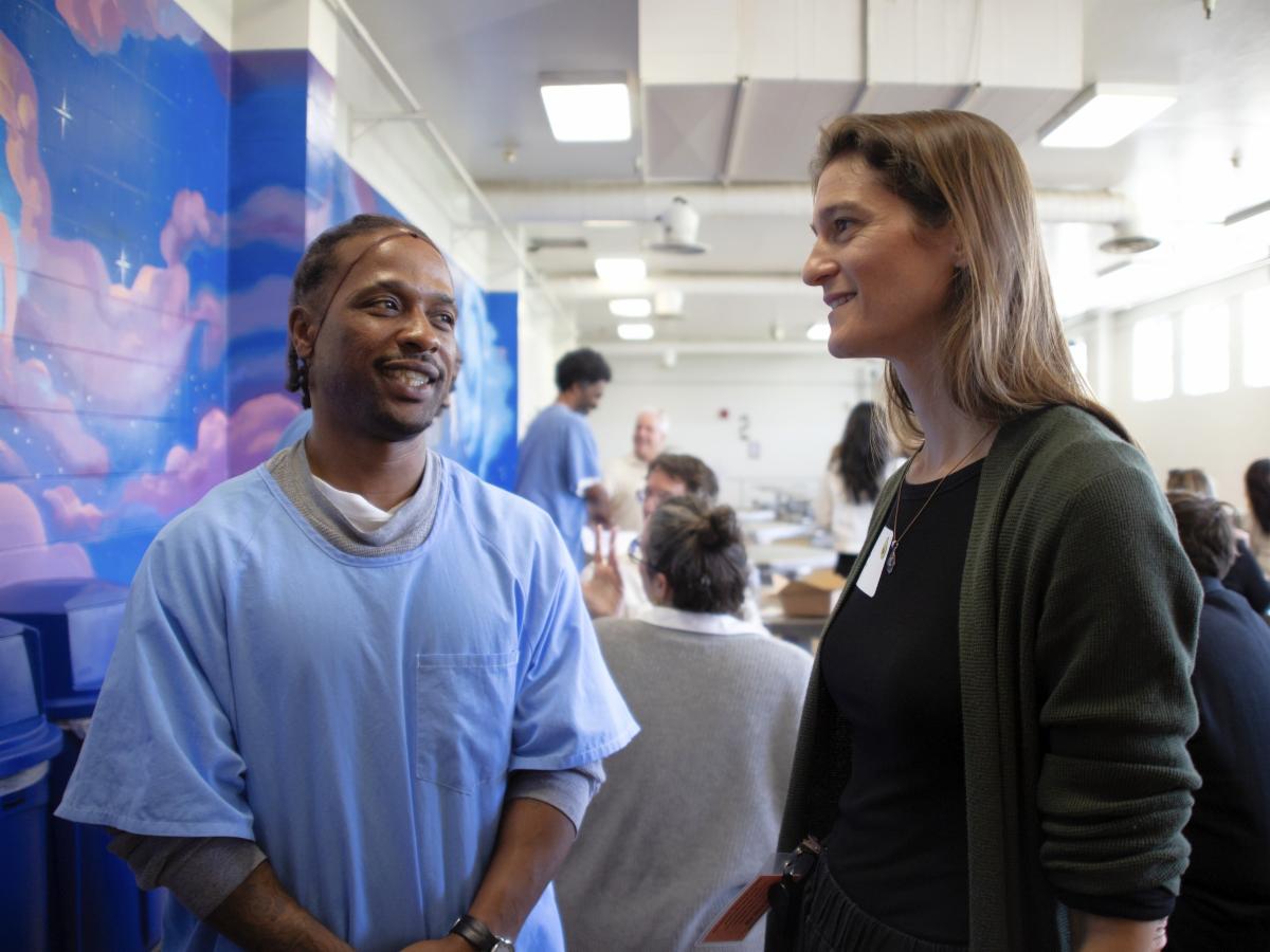 Grower Sarah Weil, left, speaks with an incarcerated resident at California State Prison Solano