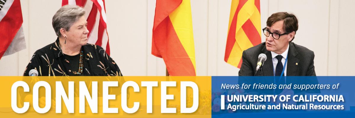 Vice President Glenda Humiston listens as Catalonian President Salvador Illa speaks into a microphone at an MOU signing event