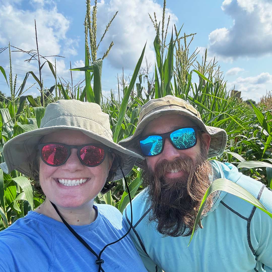 Erin Sparks and Jon Reneau in a corn field.