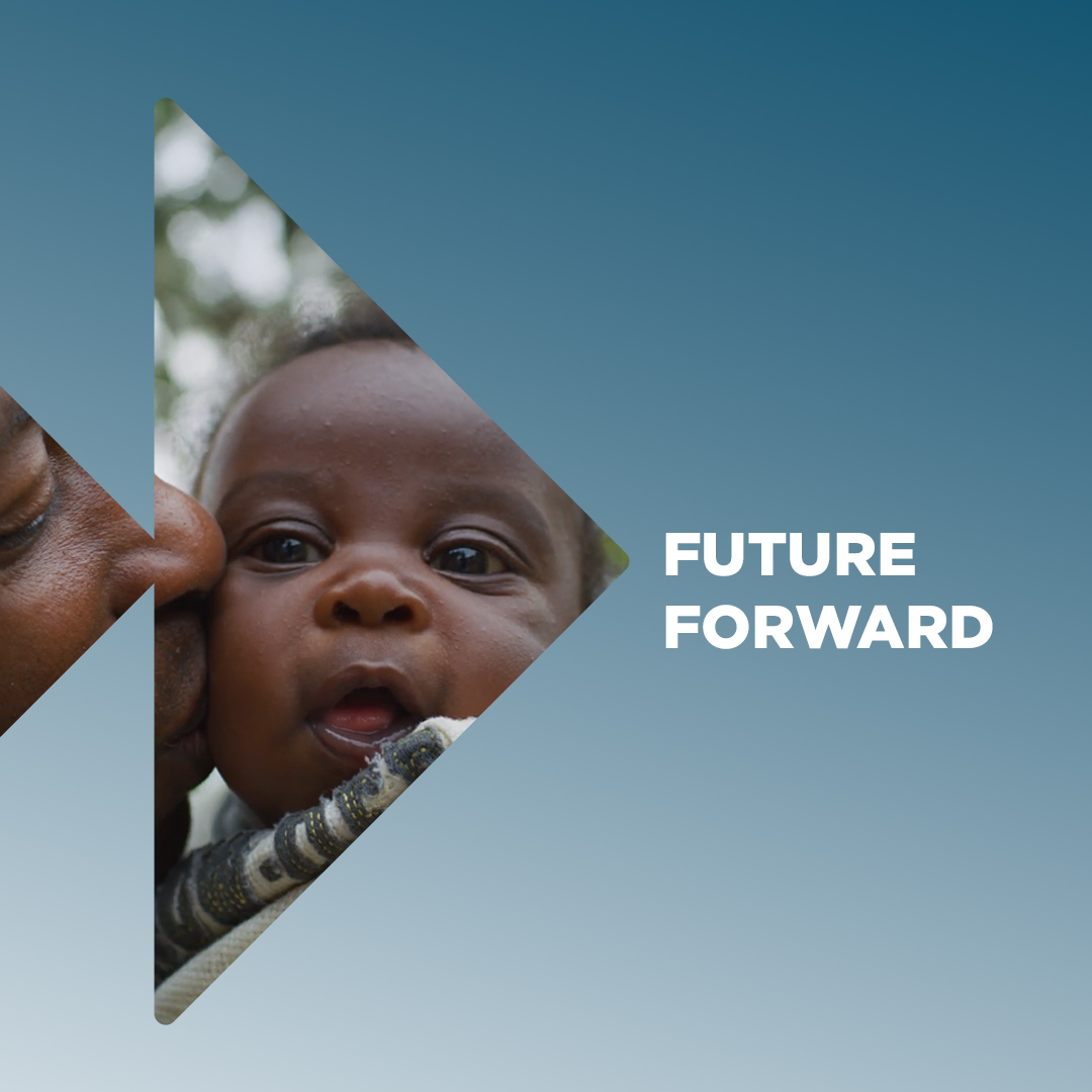 Child being kissed by parent inside of the Future Forward logo.