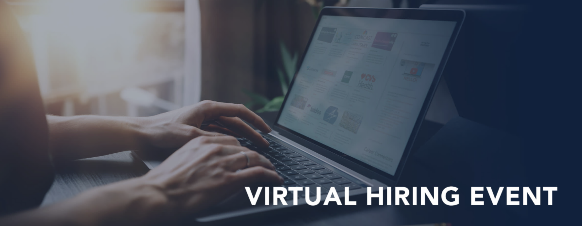 A laptop being used and 2 hand typing.