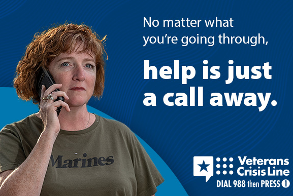 A veteran calling the suicide helpline. Text reads help is just a call away. Veteran crisis line call 9 8 8 then dial 1.
