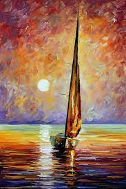A sailboat in front of a colorful sunset