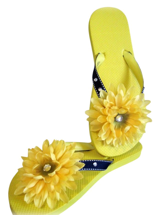 yellow flip flops decorated with yellow flowers