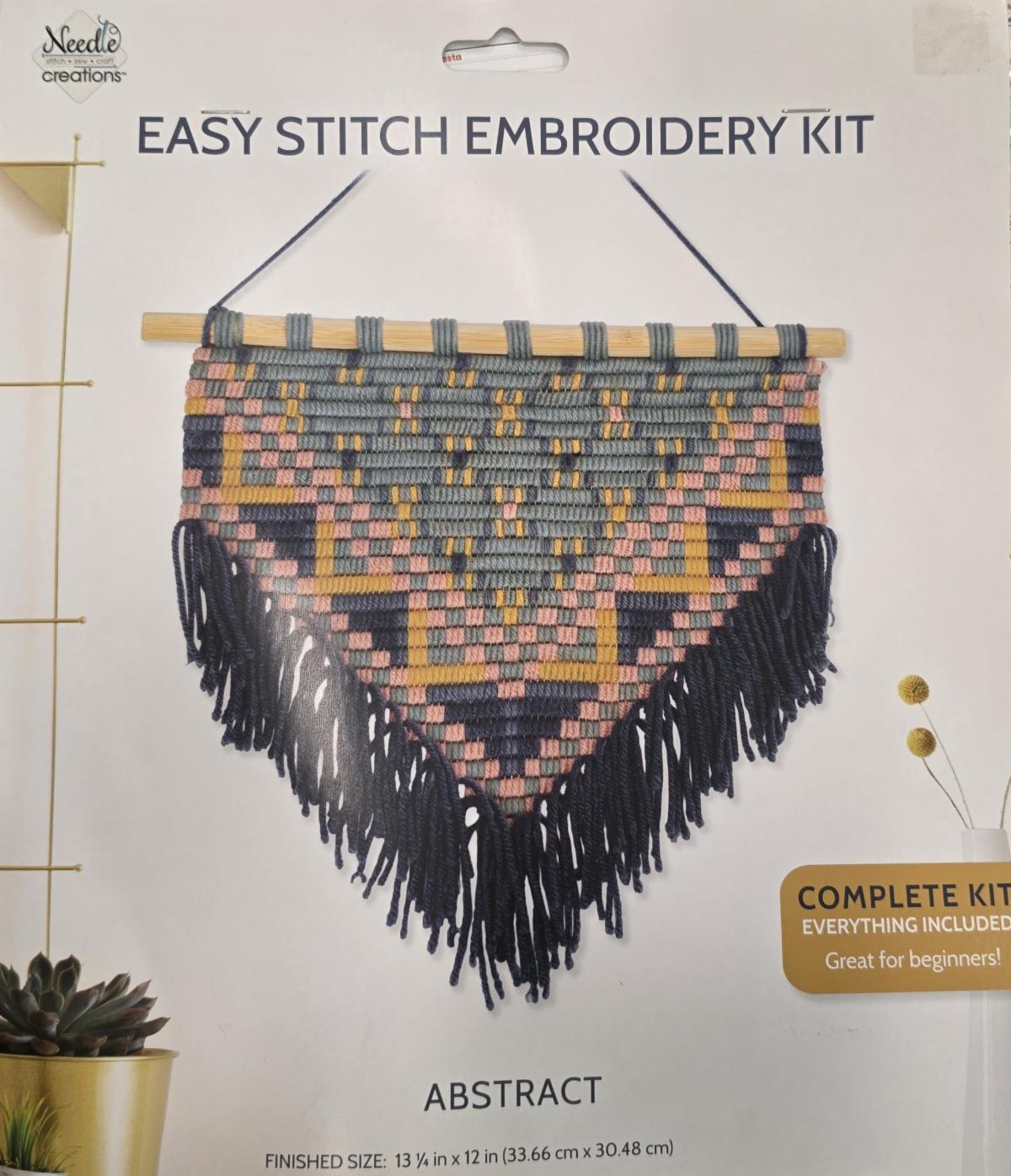 An embroidered wall hanging kit.
