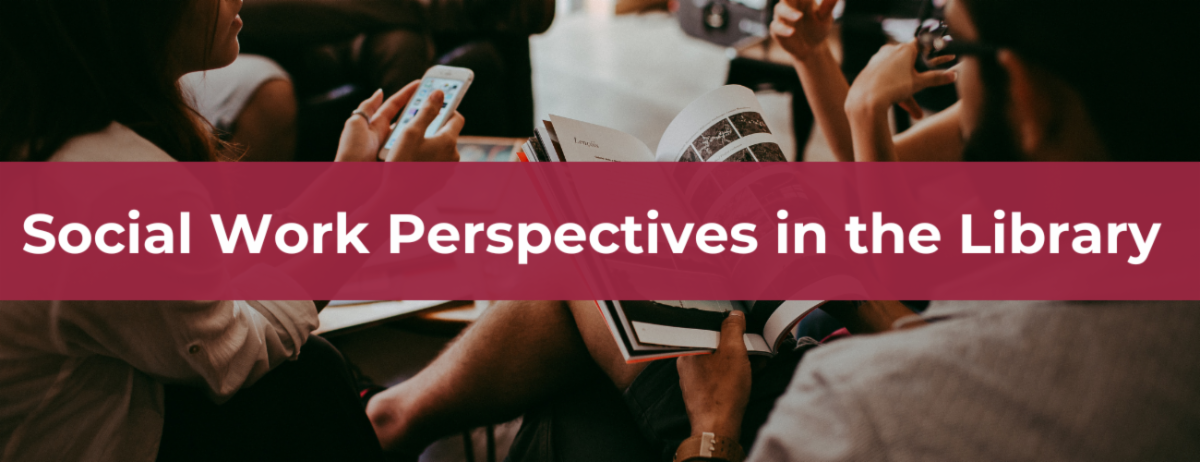 Several people holding reading materials or personal devices while sitting together in a library setting.