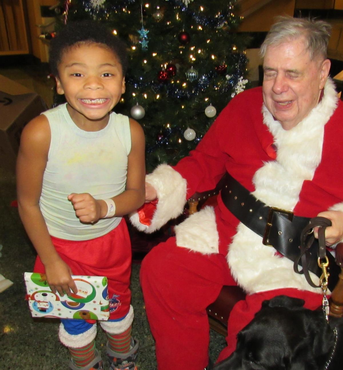Student posing with Santa