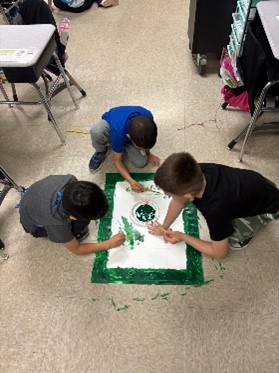 Students creating soccer themed board game