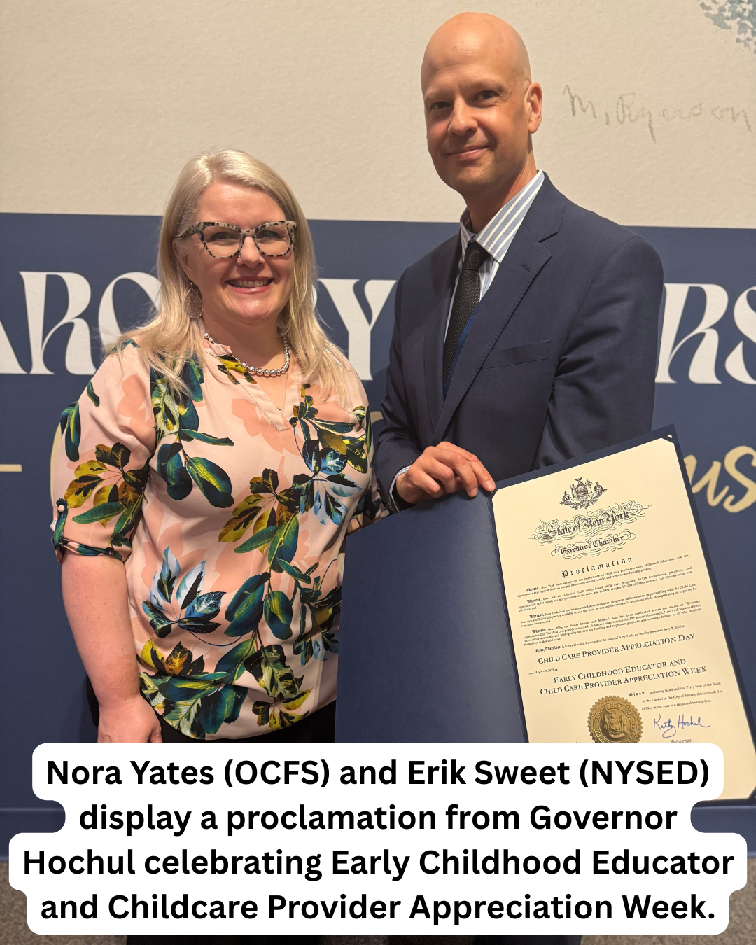Nora Yates and Erik Sweet display a proclamation from Governor Hochul