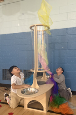 Two young students playing with sensory toys