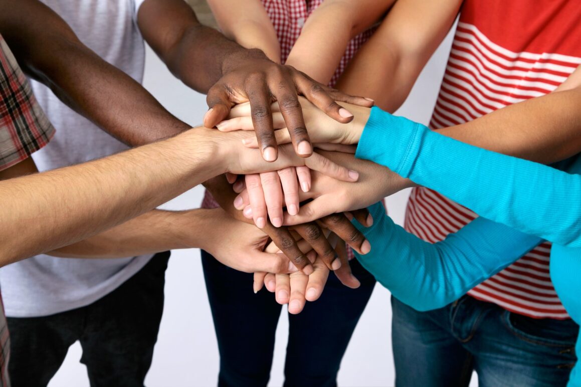 Student hands all overlapping