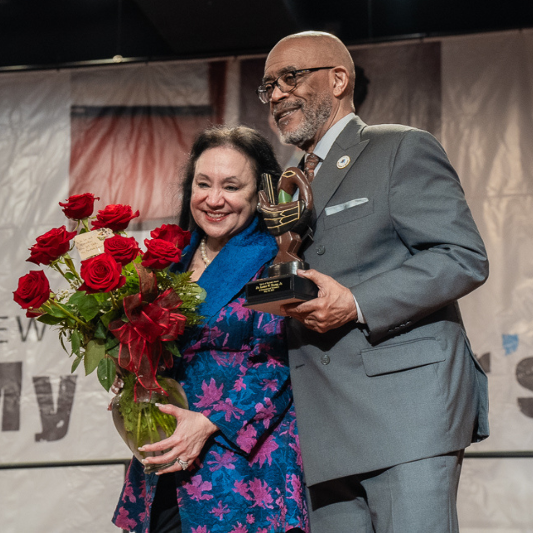 Chancellor Young and Commissioner Rosa holding awards