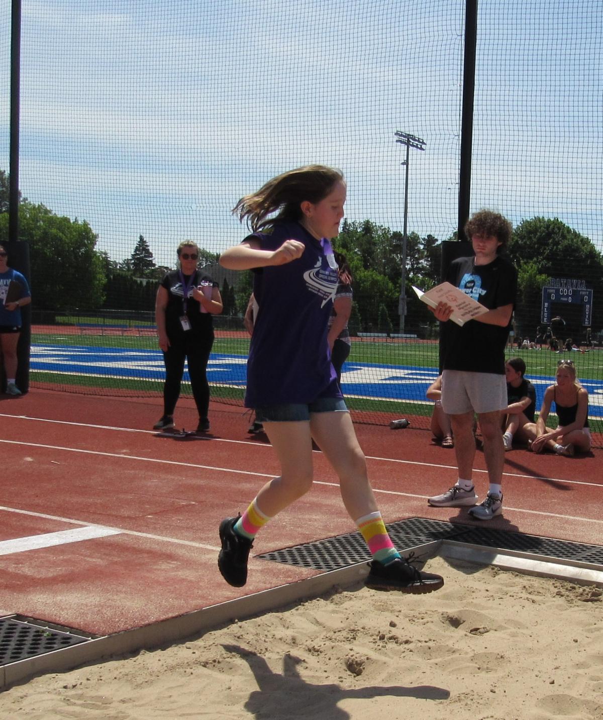 New York State School for the Blind Special Olympics, student jumping