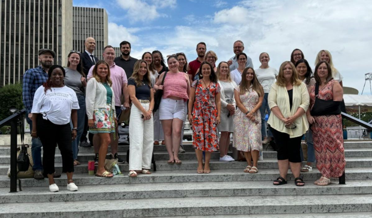 photo of office of early learning staff outside on steps