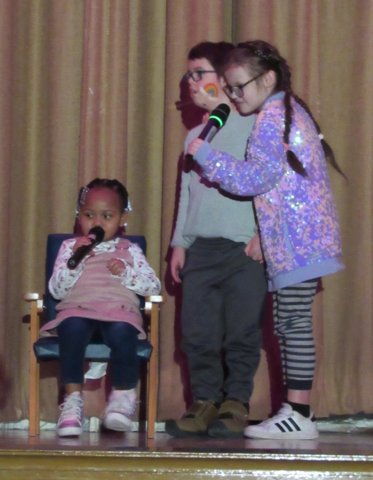 Students singing on stage