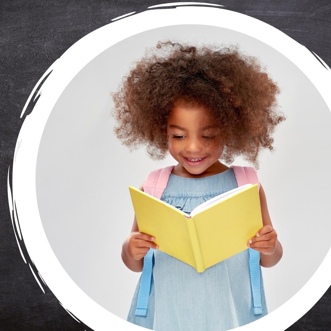 young girl reading a bright yellow book