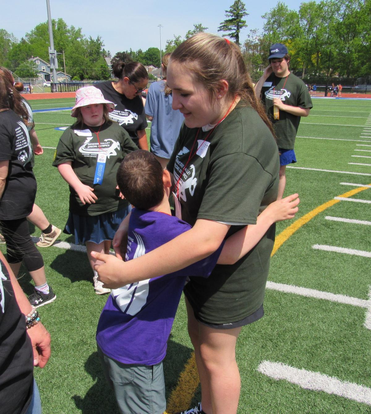 Special Olympic student hugging