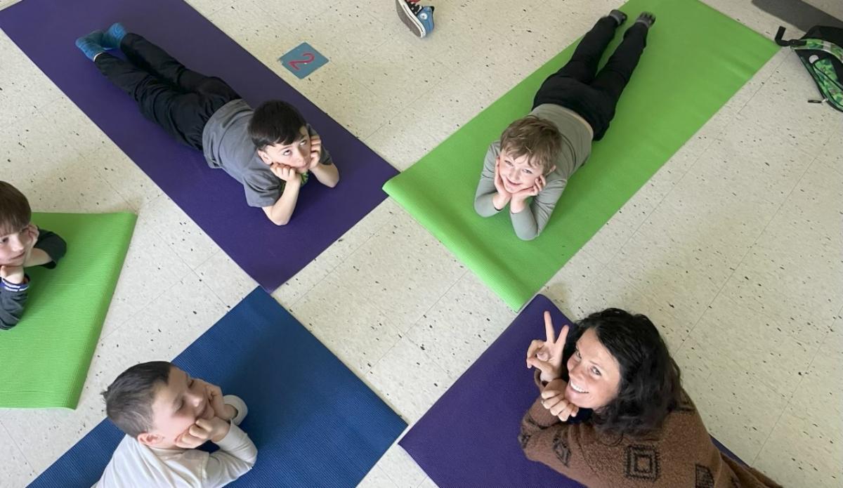 Students lying on yoga mats