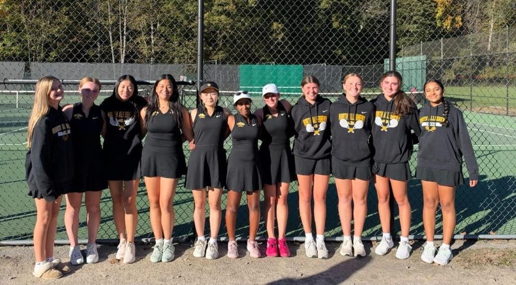 The North Allegheny girls tennis team poses for a group photo on an outdoor tennis court following their 3-2 WPIAL Class 3A consolation match win over Upper St. Clair.