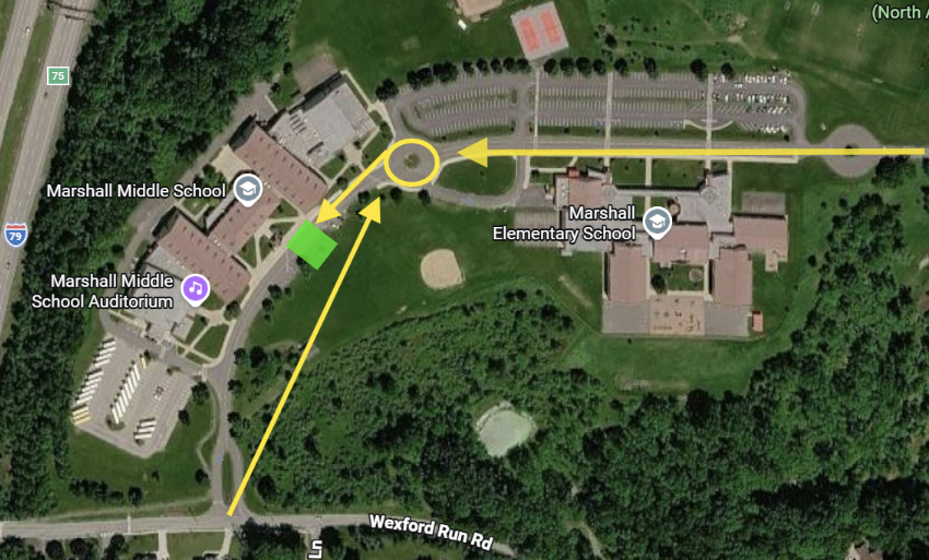 Aerial map showing morning drop-off routes for Marshall Middle School. Yellow arrows show vehicles entering from Wexford Run Road or Shenot Road, circling around the flagpole roundabout, and proceeding to the designated drop-off zone highlighted in green at the front of MMS.