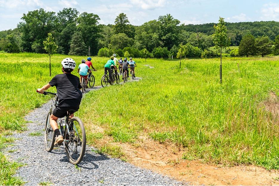 people bike on rural trail