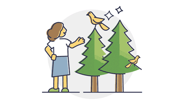 woman standing next to two trees, each with a yellow bird