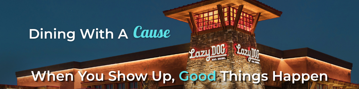 Promotional banner showing a warmly lit Lazy Dog restaurant at dusk, with text: Dining With A Cause and When You Show Up, Good Things Happen.