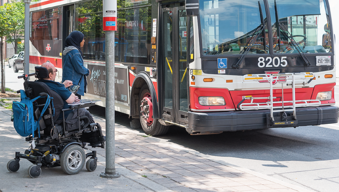 Image of a TTC bus with a person getting on