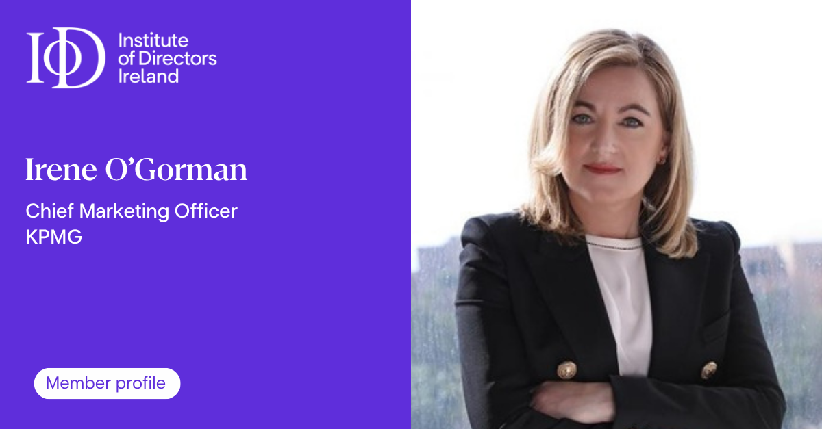 Profile card for Institute of Directors Ireland featuring a purple background on the left with text Irene O’Gorman Chief Marketing Officer KPMG and a button labelled Member profile. On the right is a person wearing a black blazer with gold buttons over a white top standing with arms crossed in front of a light background.