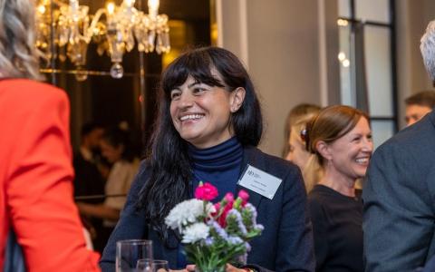 Guests smiling and networking at an event