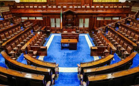 Image showing the interior of Dail Eireann. Rows of empty seats. Blue carpet