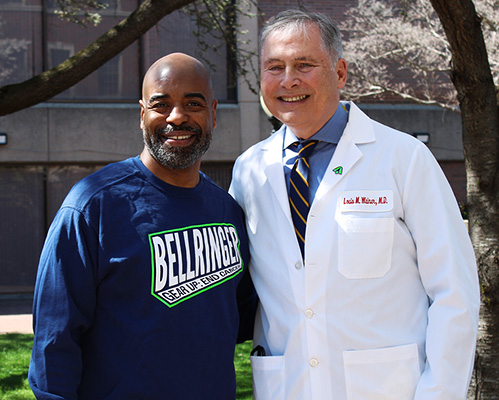 Tony Covington and Dr. Weiner stand side by side outdoors