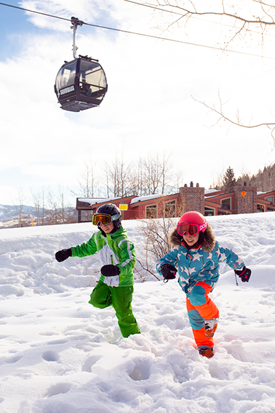 Kids running in Snowmass Colorado