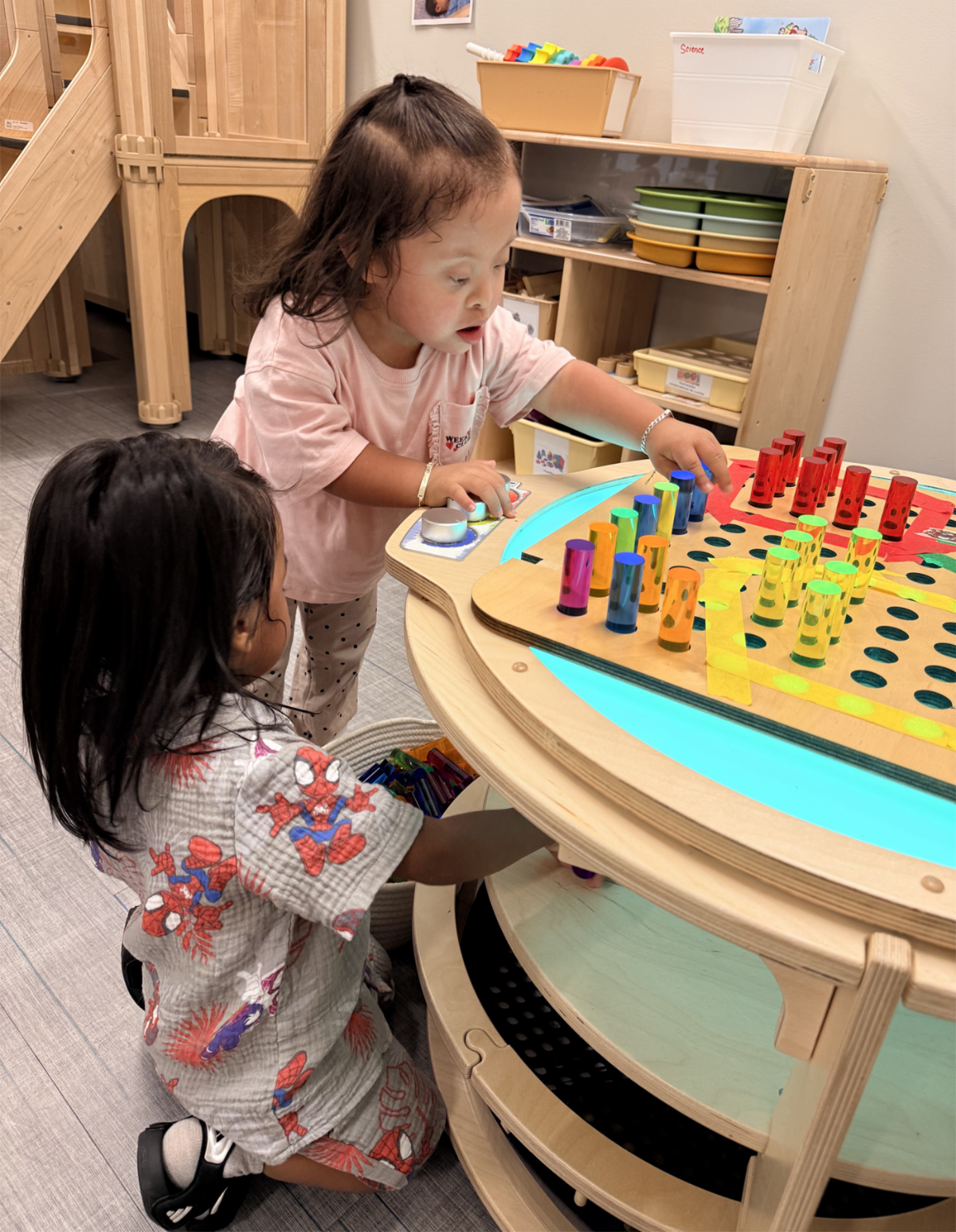 Two children playing at the Family Support Center