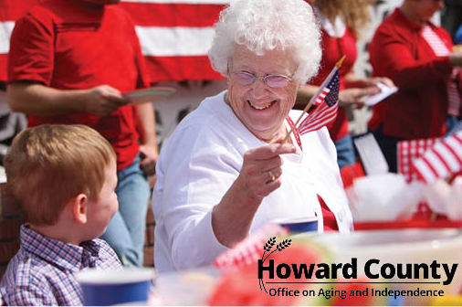 Older adult woman waving a flag